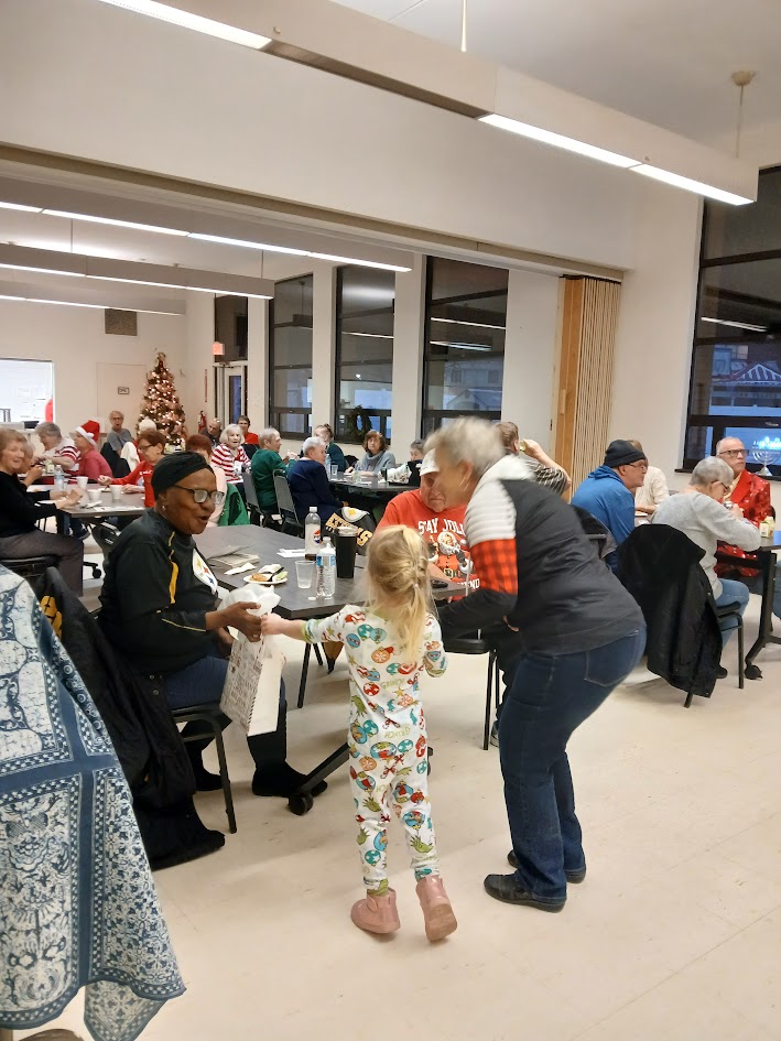 People mingling at the Angel Tree party